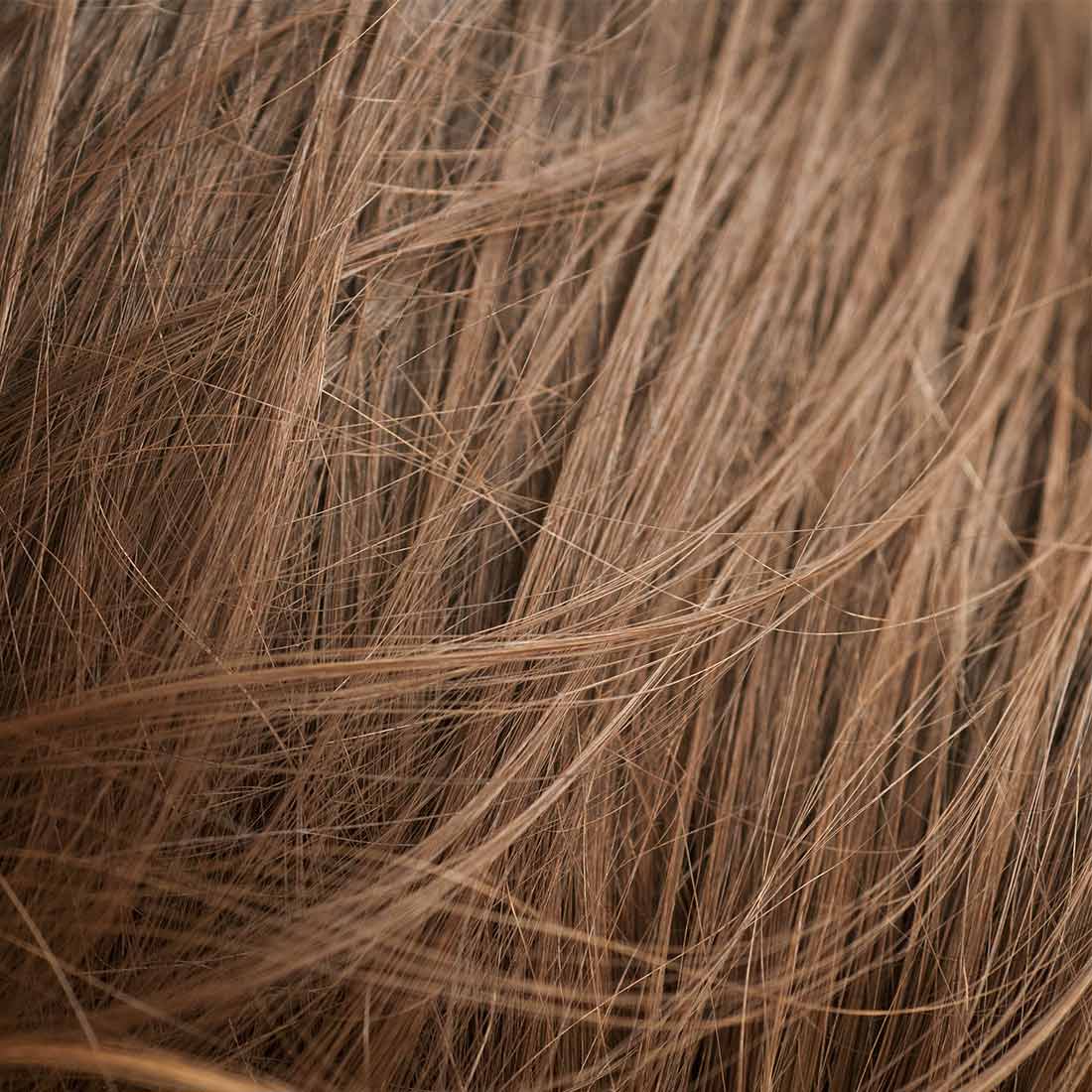 A close up of the hair on someones head