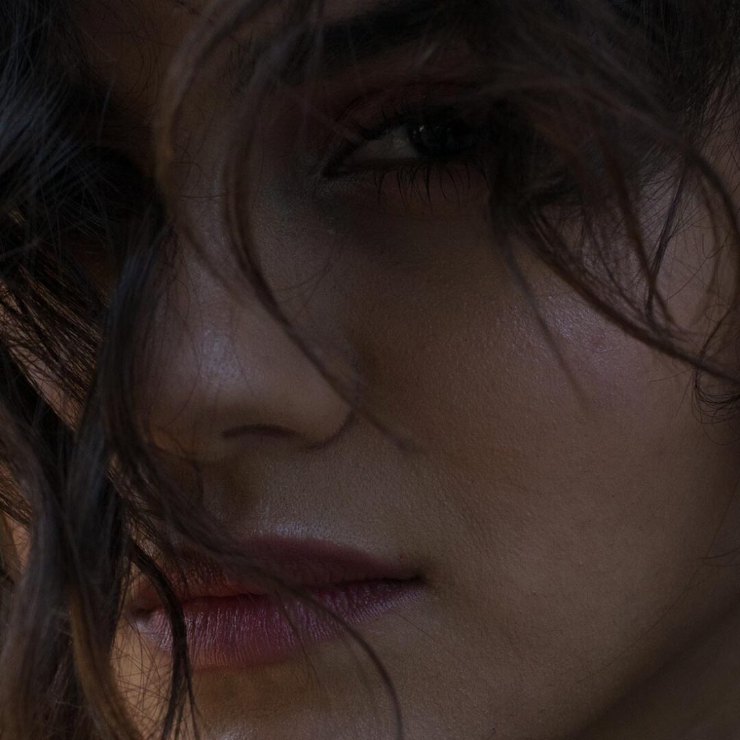 A close up of a person with long hair