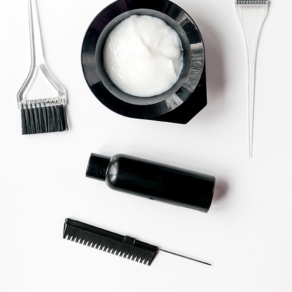 shop-image-12-gallery-2 A white table with some hair products and brushes