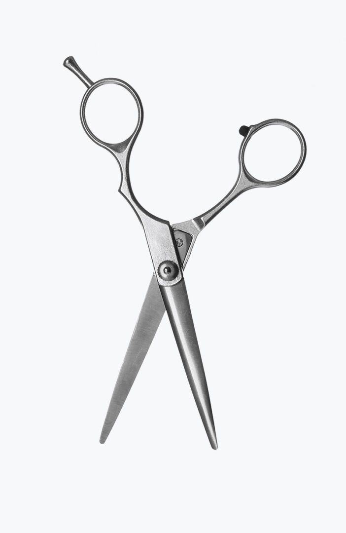 A pair of scissors with one blade missing.