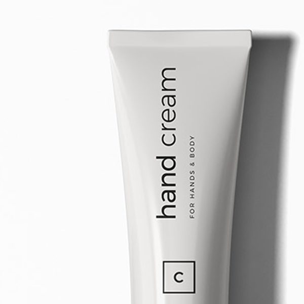 shop-image-9-gallery-2 A white tube of hand cream sitting on top of a table.