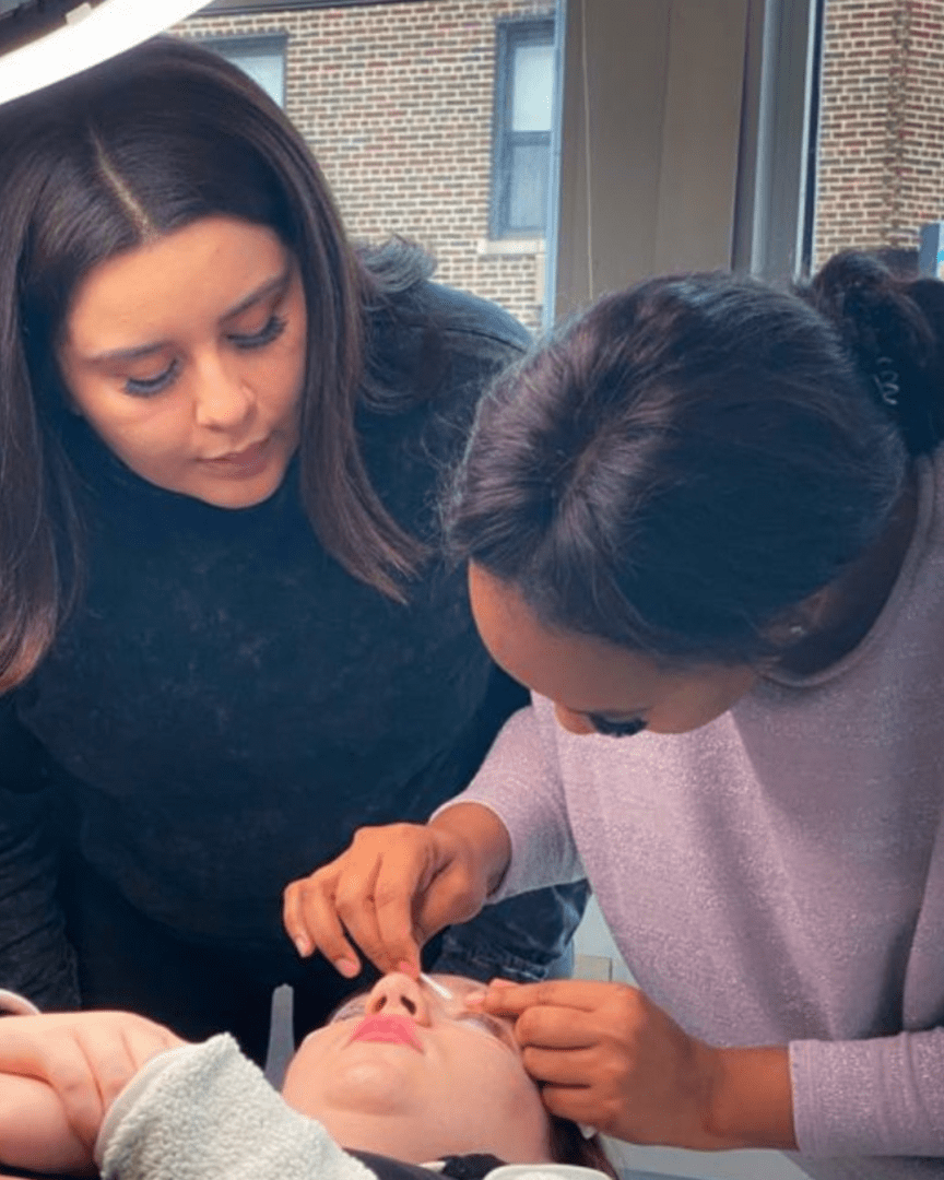 Lash training teaching a student how to perform a lash lift.